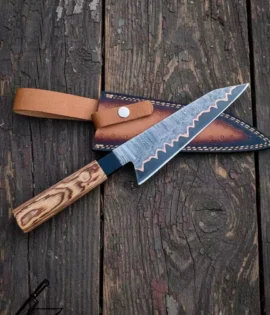 Hand forged copper Damascus chef knife with Pakka wood handle.